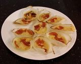 A picture of step 8 of Pan Roasted Cheese Filled Onion Petals with Bacon a6nd Pepperoni.