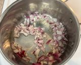 A picture of step 3 of Yellow Rice with Jalapeños and Tomatoes.
