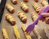 A picture of step 4 of 🎃 TASTY Halloween Ideas! Puff Pastry Sausage Mummies & Creepy Fingers 👻.