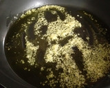 Foto del paso 7 de la receta: Arroz caldoso de bogavantes y langostinos al whisky con coquinas al ajillo