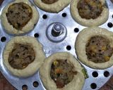 A picture of step 9 of Dhokla in idli version stuffed with cheezee rice patty.