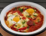 A picture of step 9 of Saganaki with Country Sausage, Eggs, and Graviera Cheese.