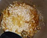A picture of step 5 of Onion turmeric pulao wrapped in egg.