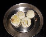 A picture of step 2 of Veg clear soup with sliced boiled egg.