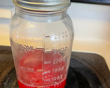 A picture of step 4 of Strawberry simple syrup.