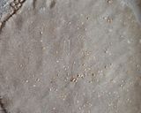 A picture of step 2 of Bajra Bhakri with seasome seeds.