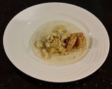 A picture of step 17 of Crab and Shrimp Enchiladas with Hatch Chili Sauce.