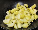 A picture of step 4 of Amla ka meetha achaar (Indian gooseberry sweet pickle).