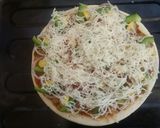 A picture of step 5 of Cheesey Pav Bhajji Pizza.