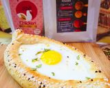 A picture of step 6 of Khachapuri with four cheese.