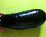 A picture of step 1 of Aubergine chips / baingan bhaja / Pan Chips.