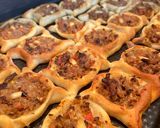 A picture of step 8 of Lebanese homemade meat pies/ Lahm bi Ajeen or Sfiha.