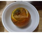 A picture of step 3 of Orange Kulfi in orange shell.