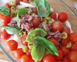 A picture of step 1 of Baked Cod with Cherry Tomatoes, Onion, Olives, and Anchovies.
