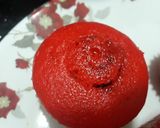 A picture of step 3 of Red cup cakes with chocolate center.