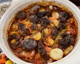 Foto del passaggio 7 della ricetta Carne al forno con patate e sugo di pomodoro