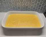 A picture of step 1 of Baked Polenta with Roasted Cherry Tomato Sauce and Italian Sausage.