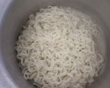 A picture of step 1 of Spaghetti with marinara sauce with cheese corn toast.