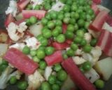 A picture of step 3 of Cauliflower, Potato, Peas, and Carrot Curry.