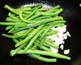 A picture of step 4 of Buttery Sautéed French Beans with sesame seeds.