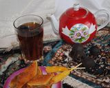 A picture of step 3 of Persian style black tea with dried lime.