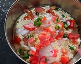 A picture of step 3 of Besan onion tomato chilla.