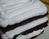 A picture of step 10 of Snow village cake.