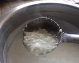 A picture of step 1 of Kesari Rasmalai topping with crunchy nuts.