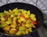 A picture of step 3 of Green papaya with black chana and potatoes.