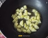 A picture of step 2 of Aloo Gobhi Matar Curry.
