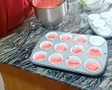 A picture of step 6 of Pinky mixed fruit Cupcakes.