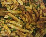 A picture of step 4 of Masala fries/ chips.