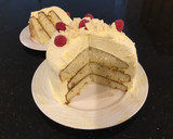 A picture of step 15 of Vanilla Layer Cake filled withLenon and Rasberry and frosted with Fresh Lemon Cream.