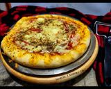 A picture of step 4 of Paneer and onion pizza.