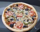 صورة لخطوة 6 من وصفة بيتزا بعجينة السبع دقايق 🍕🍕