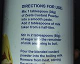 A picture of step 1 of Maize Malva Pudding drizzled with custard.