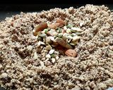 A picture of step 2 of Wheat flour seeds and nuts Ladoo with leftover ghee residue.