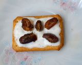 A picture of step 1 of Tuc with fresh cream and date.