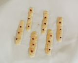 A picture of step 3 of Cheese crackers with pink peppers.