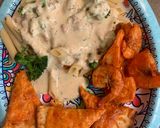 A picture of step 7 of Bobby&Whittney”s Homemade Penne Chicken Alfredo with broccoli and shrimp.