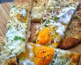 A picture of step 3 of Baked Naan With Cheese, Egg & Chilli.