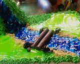 A picture of step 13 of Blackforest jungle theme cake.