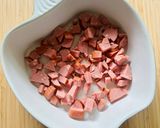 A picture of step 1 of Cheese appetizer with tomatoes and sausage.