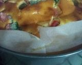 A picture of step 10 of Vanilla tutti fruity cake with Mango topping.