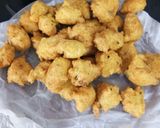 A picture of step 2 of Pakodi ki kadhi with plain rice.