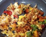 A picture of step 3 of Egg Burrito with Peppers and Chorizo Queso.