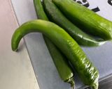 Une image de l'étape 5 de Dorades royales en papillote à l ail, citron et persil avec piments grillés.