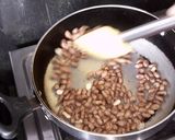 A picture of step 1 of Moong fali Til Ladoo.