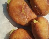 A picture of step 15 of Donuts filled with vanilla custard ice.