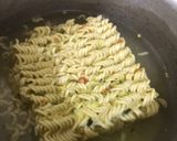A picture of step 1 of Knorr noodles with pink sauce.
